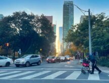 A man crosses a road in Canada